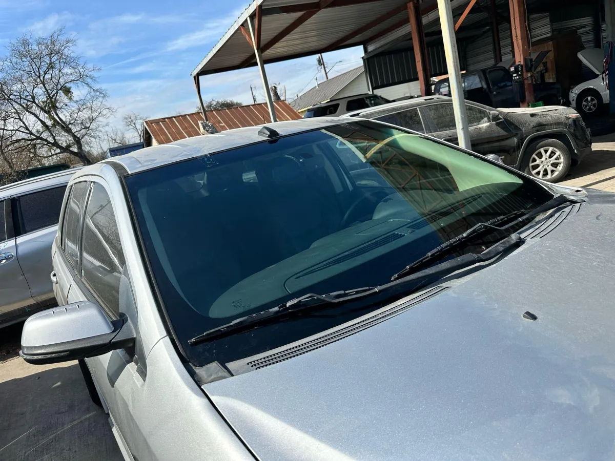 Windshield replacement completed on silver sedan