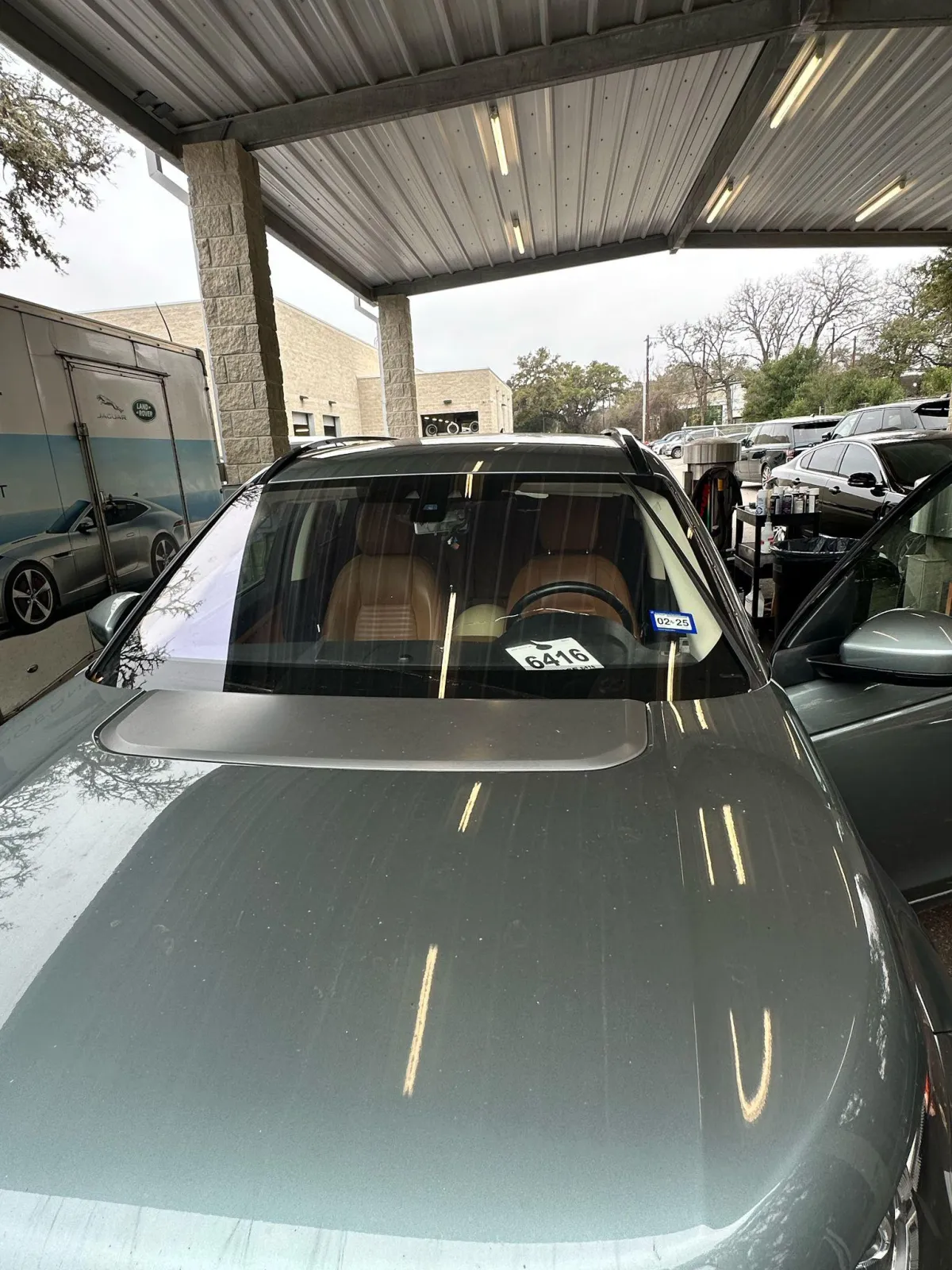 Luxury SUV windshield replacement at Converse shop